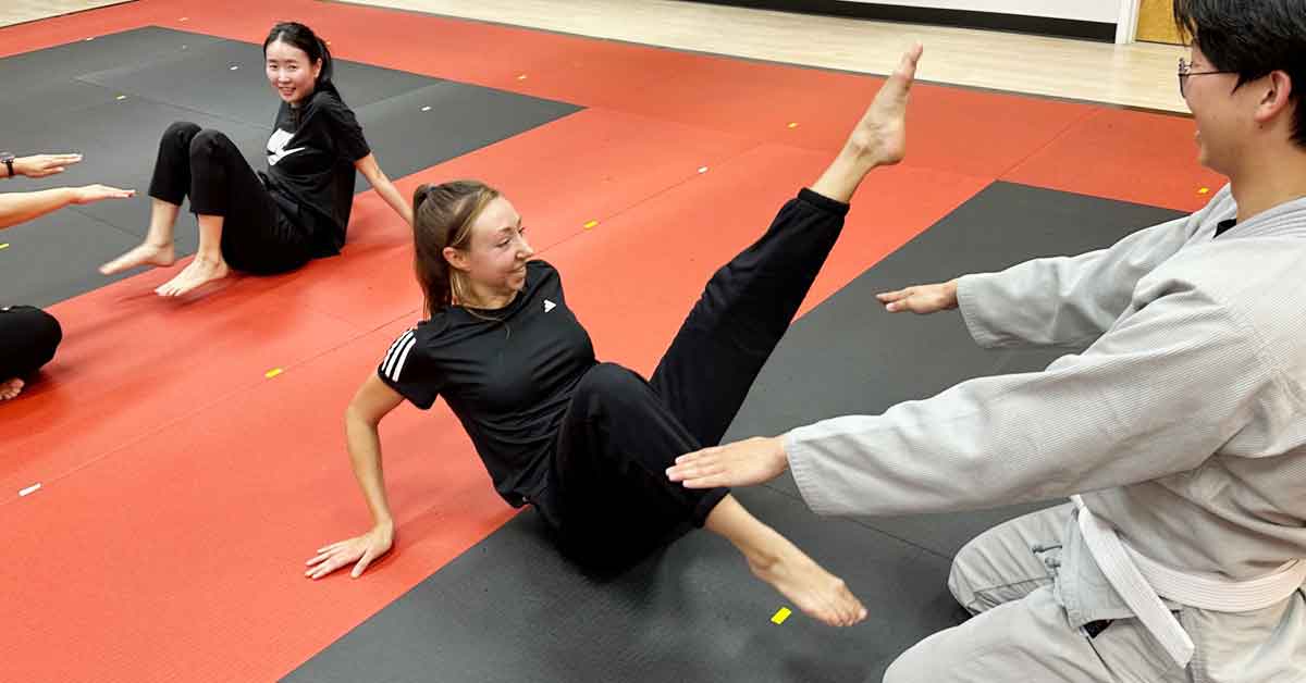 a woman is doing egg beaters with partner